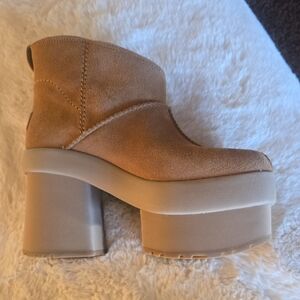 the UGG Classic Ultra Mini New Heights Platform BootTan Platform Ankle Boots